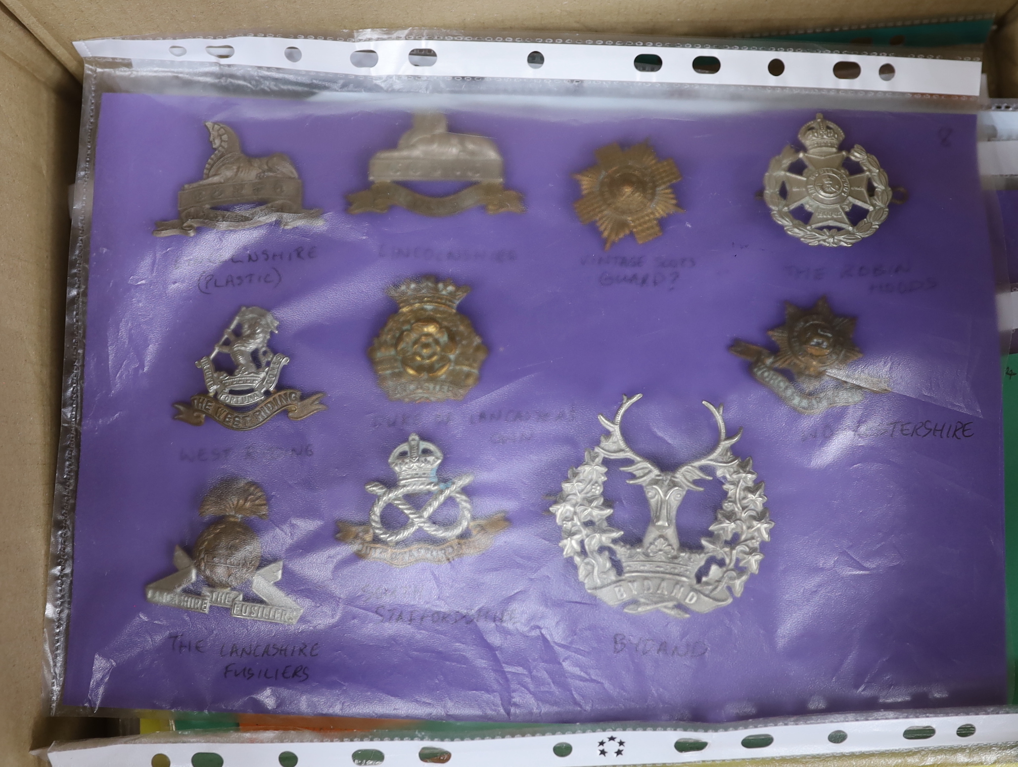 A collection of c.100 British military cap badges including South Staffordshire and Royal Artillery, Scottish regiments etc.